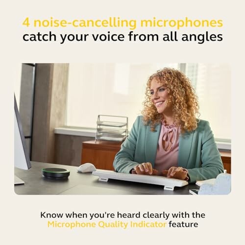 Person at a desk using noise-cancelling microphones with text about microphone quality indicator.