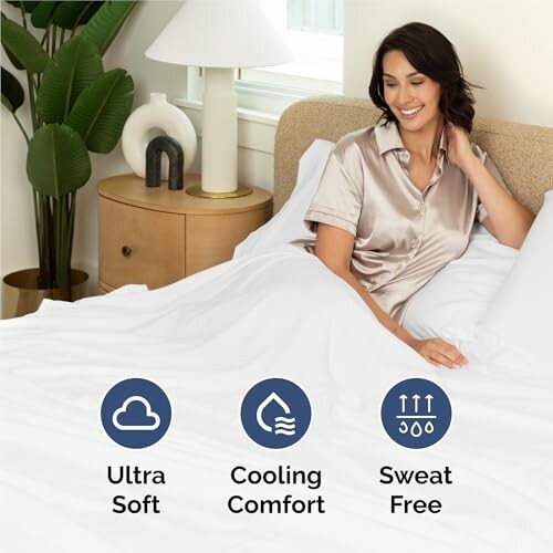 Woman in bed with soft bedding, showcasing comfort features.